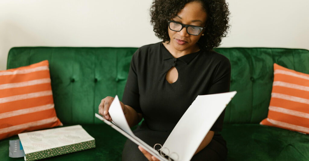 woman looking through a file
